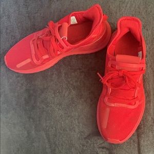 Red Adidas running shoes